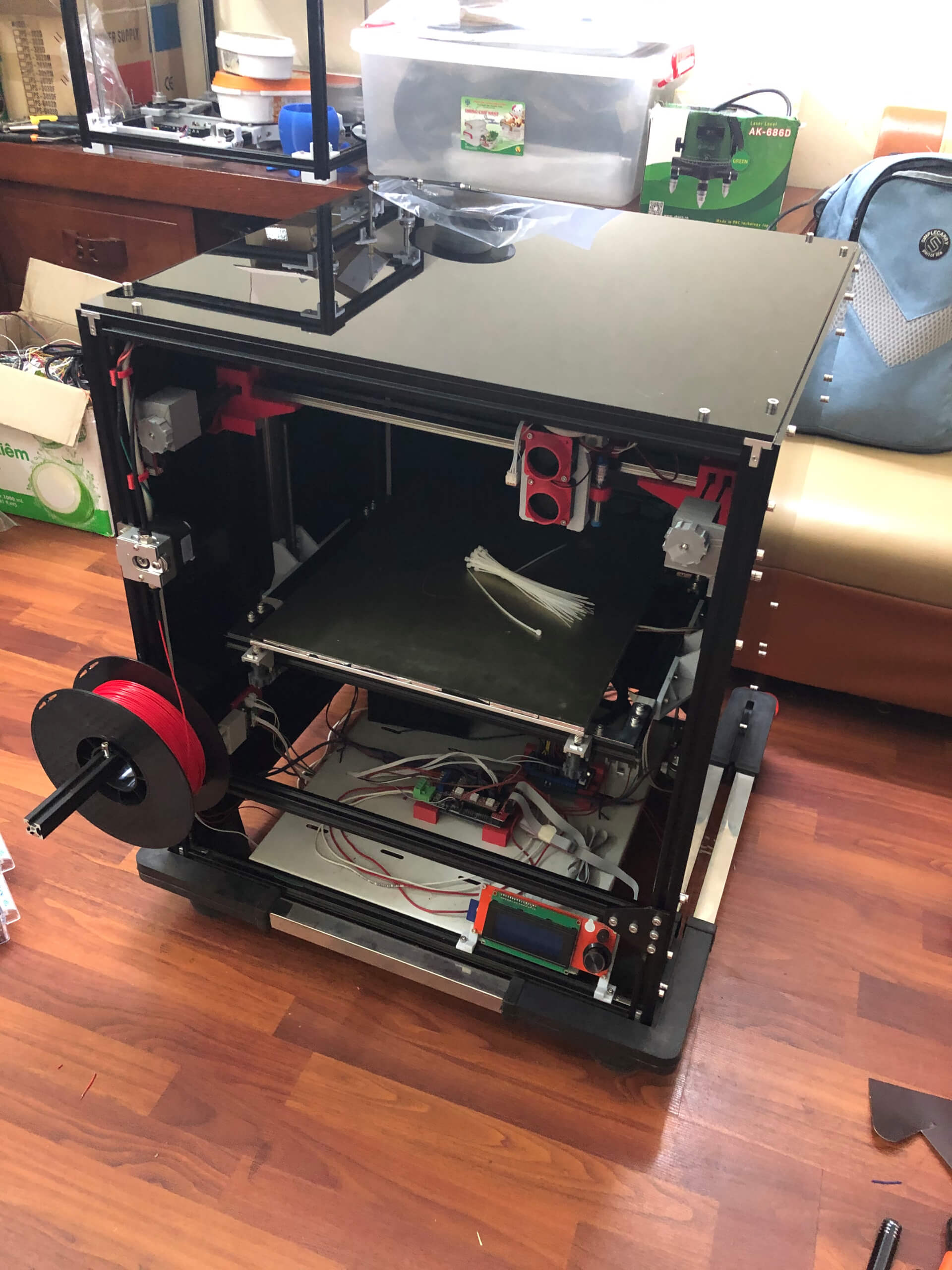 Large custom CoreXY 3D printer occupying significant workshop space