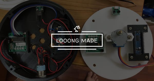 Top-down view of two 3D printed enclosures with embedded electronics, showing an Arduino Nano, stepper motor, driver boards, sensor modules, and wiring.